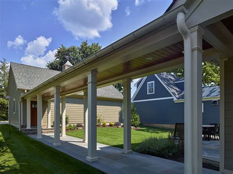 covered walkway from detached garage to house metal roof|covered garage walkway interior.